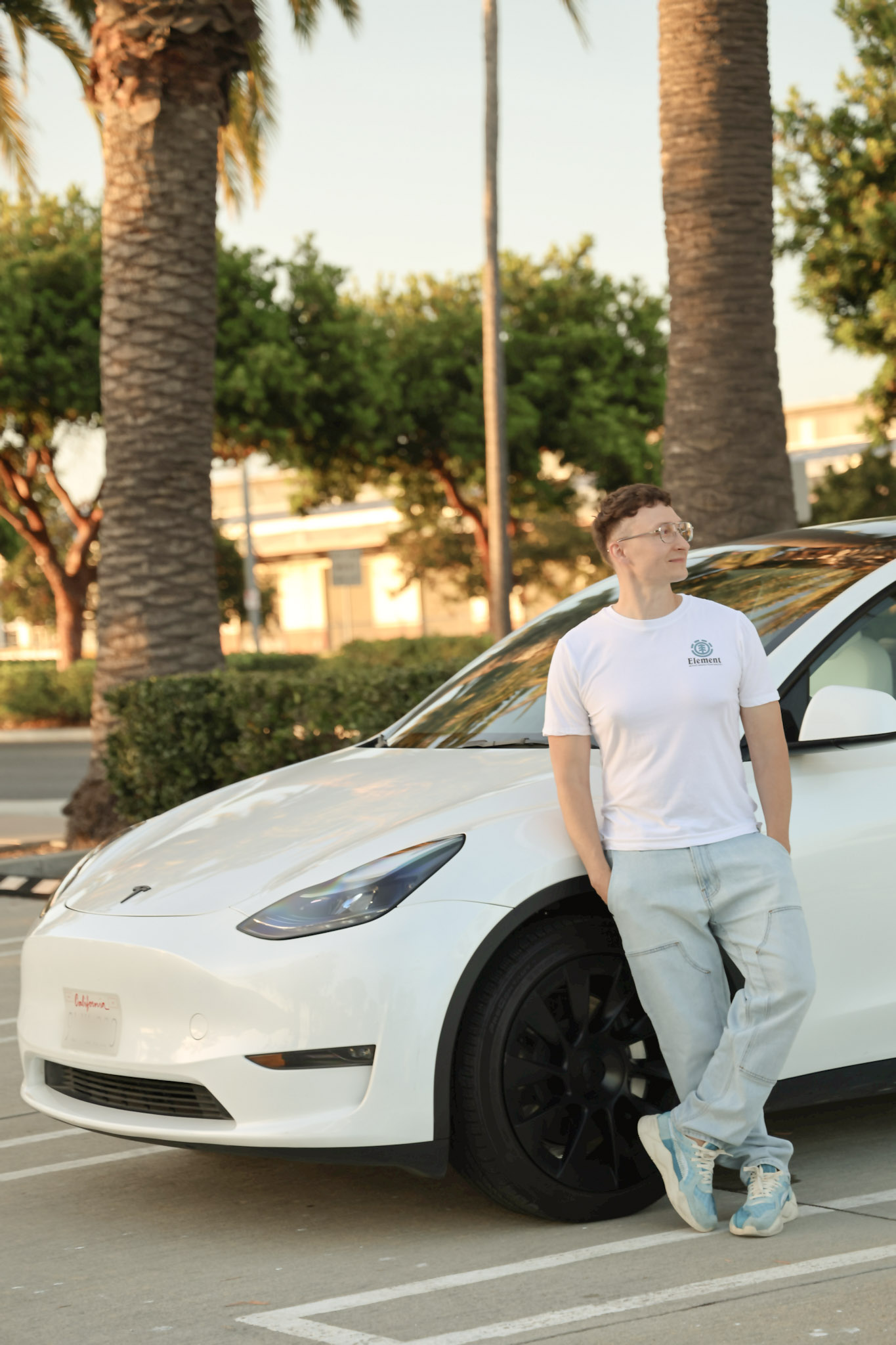 Arek standing beside the white training car